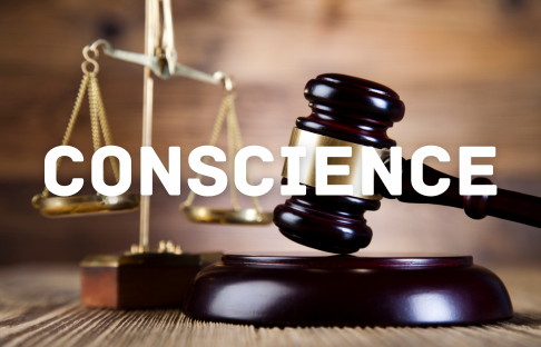 A judge 's gavel and the word conscience on top of it.